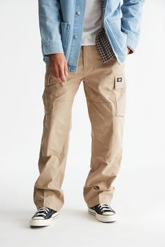 Classic cargo pants by Dickies in a relaxed straight leg silhouette with a mid-rise waist. Topped with utility style pockets at the sides. Fitted with a zip fly and button closure. Features Cargo pants from Dickies Straight leg pants Zip fly; button closure Content + Care Machine wash Imported Size + Fit Model is 6’1" and wearing size 32 | Dickies Eagle Bend Cargo Pant in Tan, Men's at Urban Outfitters Straight Leg Cargo Jeans For Outdoor Fall Activities, Streetwear Work Pants With Multiple Pockets, Streetwear Full-length Work Pants With Multiple Pockets, Outdoor Straight Leg Parachute Pants With Cargo Pockets, Casual Straight Leg Cargo Pants With Multiple Pockets, Outdoor Parachute Pants With Cargo Pockets And Straight Leg, Full Length Work Pants With Multiple Pockets For Streetwear, Relaxed Fit Cargo Jeans For Outdoor, Urban Cargo Pants With Relaxed Fit And Straight Leg