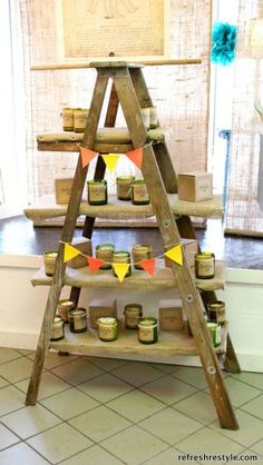 a wooden shelf with jars on it in front of a window and a sign that says,