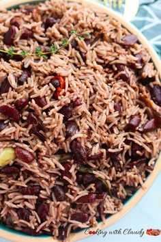 a bowl filled with rice and beans on top of a table