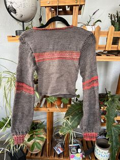 This long sleeve sweater was created by hand-knitting and using a knitting machine. 75% washable wool and 25% nylon. Fits sizes XS-S. Fitted Long Sleeve Knitted Sweater, Knitted Long Sleeve Tops With Cozy Fit, Comfortable Knitted Long Sleeve Tops, Textured Knit Long Sleeve Cropped Sweater, Textured Knit Cropped Long Sleeve Sweater, Cozy Fit Knitted Long Sleeve Tops, Fitted Cotton Winter Sweater, Cozy Stretch Knit Cardigan, Snug Textured Knit Long Sleeve Top