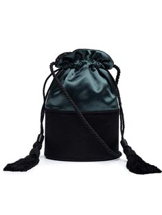 Hunting Season reimagines its Lola style in elegant proportions with a structured satin base and soft satin body with a twisted rope strap that echoes the tasseled pulls at the drawstring top. This drawstring bag showcases a satin strap with tassels perfect for a tailored feel. Fully lined. Handmade in Spain. Compositi Elegant Bucket Bag With Braided Handles, Elegant Formal Bucket Bag With Braided Handles, Elegant Evening Bucket Bag With Braided Handles, Elegant Black Bag With Tassels, Elegant Black Bags With Tassels, Chic Bucket Shoulder Bag With Tassels, Elegant Evening Bags With Tassels, Elegant Formal Bags With Tassels, Evening Pouch Bag With Tassels