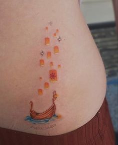 a woman's stomach with an image of a boat on it