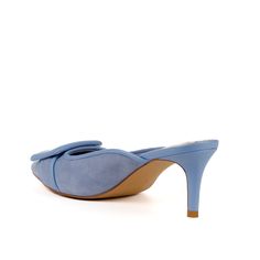 Step into contemporary elegance with Cara, a fusion of style and sophistication. Crafted in a timeless trio of black, beige, and blue suede, these mules redefine chic with a modern kitten heel and a decorative buckle that adds a touch of understated glamour to the elegant pointy-toe silhouette. The combination of suede and leather upper, coupled with a synthetic lining and sole, ensures a luxurious feel and lasting durability. The Cara buckle mule, imported for quality workmanship, rises tall with a 70mm heel height (about. 2.75"), delivering the right lift for any occasion. Transform your look with these mule sandal heels, which seamlessly combine modern style and traditional grace. Step into refinement with the Cara buckle mule, where every detail reflects your perfect taste. FIT: runs s Understated Glamour, Beige And Blue, Sandal Heels, Mule Sandals, Kitten Heel, Blue Suede, Modern Style, Bootie Boots, Kitten Heels