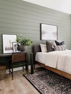 a bed sitting in a bedroom on top of a wooden floor next to a window