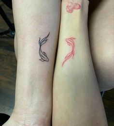 two women with matching tattoos on their arms, one has a fish and the other has a bird