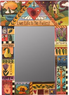 a colorful mirror with an image of a heart and words on the front, above it