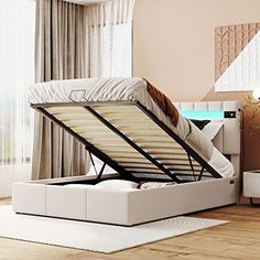 a bed that is sitting on top of a wooden floor