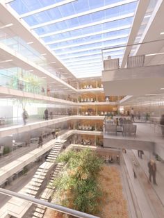 the interior of an office building with people walking around