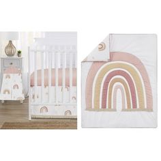 a crib bedding set with a pink and gold rainbow design on the side