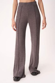 The Simply Cozy Seamed Thermal Pant features a soft, brushed waffle knit fabric that you'll want to wear on repeat. It features a high waisted elastic waistband, exposed seaming throughout, and an overall flared relaxed fit that screams comfort. Material 58% Polyester, 31% Rayon, 8% Cotton, 3% Spandex Measurements (taken from size S): Waist: 13.75", Front rise: 11.5", Back rise: 14", Inseam: 32" Slim high-waisted fit Elasticized waistband Julian is wearing a size small. Julian’s measurements: He Stretch Bottoms With Soft Texture For Fall, Relaxed Fit Flare Pants For Loungewear, Casual Flare Wide Leg Loungewear Pants, Flare Ribbed Pants For Loungewear, Ribbed Flare Pants For Loungewear, Casual Flare Wide Leg Pants For Loungewear, Trendy Fall Lounging Bottoms, Casual Flare Wide Leg Lounge Pants, Trendy Wide Leg Ribbed Bottoms