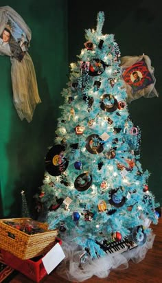 a blue christmas tree with pictures on it