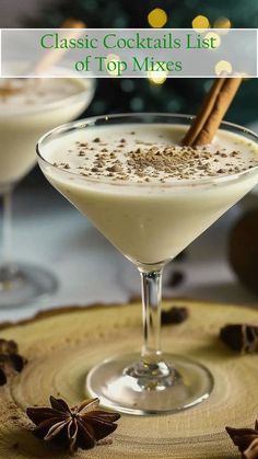 two martini glasses filled with white liquid and topped with cinnamon