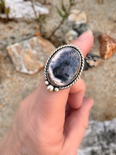 This one-of-a-kind ring will make a bold statement without all the frills. This handcrafted, minimalist boho Dendritic Moss Agate ring is handmade with love from sterling silver. This eye-catching gorgeous stone is perfect for adding a touch of nature-inspired beauty to any look and is made to last! These Stones are one of a kind, natural and vary in color and shape. Buy now - once it's gone it's gone! Approximate US size 6.25 and 35 mm x 25 mm. As the designer and silversmith behind these piece Bohemian Agate Rings With Gemstones, Bohemian Oval Agate Rings, Bohemian Agate Rings With Natural Stones, Bohemian Rings With Natural Agate Stones, Bohemian Agate Gemstone Ring, Bohemian Agate Ring With Large Stone, Handmade Agate Rings In Nature-inspired Style, Handmade Agate Rings With Nature-inspired Style, Handmade Adjustable Agate Ring