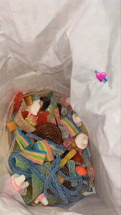 a bag filled with lots of different colored candies