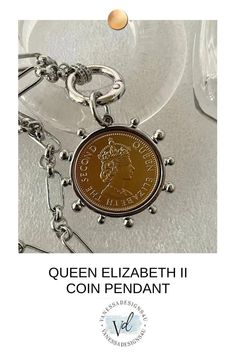 Queen Elizabeth II Gold Coin Pendant, Silver Multi Link Chain Necklace, Reproduction Royal Coin Pendant, Art Deco Silver bezel. Spring lock clasp with CZ connectors. Material: Bezel is made of Cast Zinc Alloy and the coin is of Brass Measure - Bezel and coin = 40mm Coin = 28mm Silver Metal Engraved Coin Necklace, Silver Engraved Metal Coin Necklace, Silver Coin Necklace As Gift, Silver Coin Necklace With Chain As Gift, Silver Coin Necklace With Chain For Gift, Engraved Silver Metal Coin Necklace, Silver Coin-shaped Necklace With Chain, Vintage Silver Coin Necklace With Chain, Silver Coin-shaped Metal Necklaces