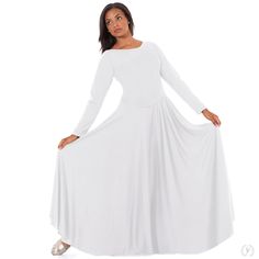 a woman in a white dress is posing for the camera with her hands on her hips