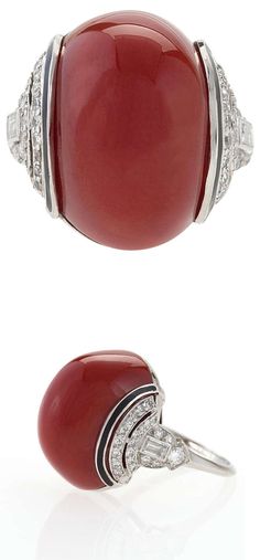 Art Deco Diamond, Red Coral, Enamel and Platinum Ring. An Art Deco platinum ring with red coral and diamonds. This ring centers on an ox blood red coral cabochon that is enhanced with 45 round-cut and 2 rectangular cut diamonds with an approximate total weight of .80 carats. The ring is further decorated with black enamel. Circa 1920's. Diamond Red, Red Art Deco Jewelry With Center Stone, Luxury Art Deco Ruby Jewelry, Luxury Red Coral Jewelry, Red Art Deco Hallmarked Jewelry, Art Deco Jewelry Rings, Elegant Multi-strand Red Coral Jewelry, Coral Jewelry