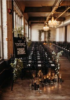 rows of chairs with signs and candles on them