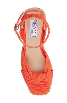 A knotted vamp accent brings modern dimension to a boho-cool sandal lifted by a raffia-wrapped platform and integrated wedge heel. 3" heel; 1" platform Adjustable ankle strap with buckle closure Cushioned footbed with arch support Synthetic upper, lining and sole Imported Platform Heels For Beach Season, Orange Sandals With Woven Sole For The Beach, Orange Synthetic Wedge Sandals For Vacation, Orange Beach Sandals With Woven Sole, Orange Synthetic Heels For The Beach, Orange Synthetic Heels For Beach, Orange Wedge Heel Sandals For The Beach, Straw Ankle Strap Espadrilles For Beach, Straw Ankle Strap Espadrilles For Beach Season