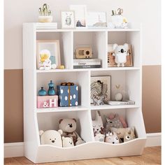 a white book shelf filled with stuffed animals