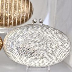 "Heart- stoppingly beautiful design and sparkle! These Evening Formal Oval shaped Purses in gold, gold with pearls and ALL CLEAR will be the talk of town!! Each is handmade. Each takes months to complete, one crystals at a time! Here at Etsy, we offer you the best quality at discounted prices, a fraction of what high priced retailers charge! These are evening bags that are fully covered in genuine, very fine, small sized Swarovski Crystals from Austria! One purse is in all CLEAR CRYSTALS, One is Glamorous Sparkling Clutch For Weddings, Elegant Bedazzled Formal Jewelry, Elegant Formal Bedazzled Jewelry, Elegant Crystal Evening Bag With Bling, Elegant Crystal Clutch With Bling, Elegant Evening Bag With Crystal Bling, Sparkling Crystal Evening Bag For Wedding, Elegant Bling Evening Bag, Elegant Wedding Clutch With Bling