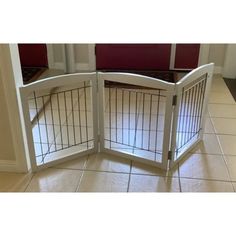 a dog gate that is open on the floor