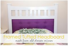 a bed with purple headboard and white frame