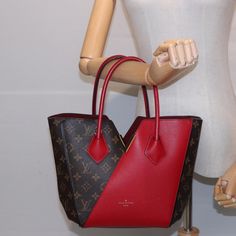 Brand: Louis Vuitton Model: Kimono Color: Red Material: Canvas Inclusions: Dust Bag Dimensions: W25cm x H25cm x D10cm / Shoulder Drop:60cm Serial number: DU2196 Country of origin: France Condition: AB - good condition. Introducing the Louis Vuitton "Kimono" Handbag, an exquisite blend of red leather and iconic brown Monogram Canvas. Meticulously crafted in France, this versatile piece can be worn as both a handbag and a tote, making it a perfect fusion of style and functionality. The exterior of Luxury Red Bags For Daily Use, Red Leather Handle Pouch Bag, Designer Burgundy Bag With Handles, Designer Burgundy Shopping Bag, Designer Burgundy Bag For Shopping, Designer Rectangular Red Bag, Designer Burgundy Shoulder Bag For Shopping, Luxury Red Pouch Bag, Designer Large Capacity Red Shoulder Bag