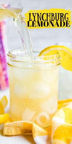 lemonade being poured into a mason jar with sliced lemons around it and the text overlay reads, lychburg lemonade