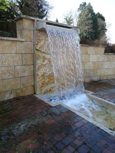 a fire hydrant spewing water out of it's side