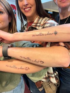 three women with tattoos on their arms and armbands that say no matter what they are