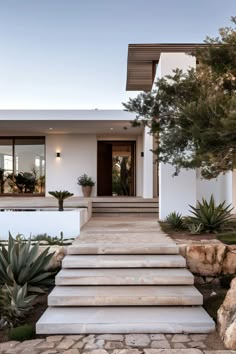 a house with steps leading up to the front door