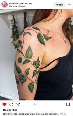 a woman with green leaves on her arm