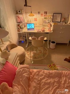 a bedroom with a desk, chair and computer