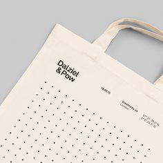 a tote bag with an ad for dahlel & bow printed on it