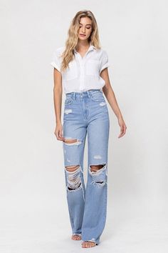 A nostalgic and stylish choice that pays homage to the iconic denim trends of the 90s. These jeans feature a high-rise waist, a non-stretch denim construction, distressed details, and a raw hemline, capturing the essence of vintage style.F. Rise: 11.5" / Inseam: 34" / Leg Opening: 20"Model is 5'9" and wearing size 26 Style: Vintage Print / Pattern: Light Denim Silhouette: Flare Fit: Relaxed Embellishment: Distressed Neck Line: NA Sleeve: NA Length: Full Length Closure: Zip Fly Lining: No Made In High Rise Distressed Flare Jeans, Ripped Flare Jeans For Spring, Spring Everyday Ripped Flare Jeans, High Rise Distressed Cotton Jeans, 90s Inspired Wide Leg Denim Jeans, Everyday High Waist Distressed Flare Jeans, Everyday High-waist Distressed Flare Jeans, Summer High Rise Distressed Flare Jeans, 90s Style Summer Denim Flare Jeans