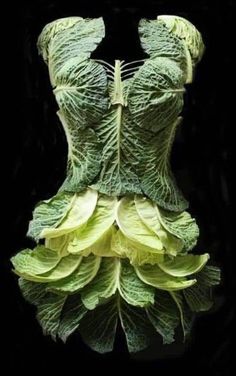 a dress made out of lettuce with leaves on the bottom and sides, all in green