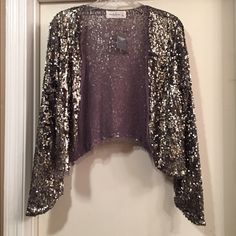 Silver/Bronze Sequin With Distressed Looking Cardigan From Abercrombie & Fitch. Lightweight. New With Tags. Size Medium. Glamorous Sequin Winter Cardigan, Glamorous Evening Winter Cardigan, Elegant Fall Party Shrug, Elegant Party Shrug For Fall, Glamorous Evening Cardigan For Winter, Glamorous Fitted Cardigan For Winter, Fitted Gold Cardigan For Fall, Glamorous Fitted Evening Cardigan, Gold Cardigan For Winter Party