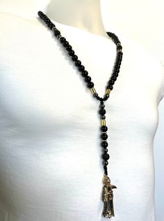 Black Santa Muerte Rosary Black natural Obsidian and Lava rock - Etsy Ecuador Black Spiritual Jewelry With Natural Stones, Black Natural Stones Jewelry For Meditation, Black Hematite Jewelry For Meditation, Black Hematite Spiritual Jewelry, Black 8mm Beads Jewelry For Festival, Black Gemstone Beads Jewelry For Festival, Black Santa, Lava Rock, Beaded Necklaces