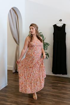 This breezy floral midi dress will have you flowing through your day in satiny textured voile. Featuring a square neckline, smocked bodice, and beautifully the flowy, tiered skirt, this dress is perfect for all of your summer activities! This dress can even be made a little more casual with a pair of sandals and lightweight sweater. floral midi dress adjustable straps smocked bodice tiered skirt straight neckline fits true to size, model wears size medium 52% cotton, 48% rayon hand wash cold, ha Flowy Dress With Straight Neckline For Day Out, Flowy Tiered Summer Dress, Flowy Strapless Floral Print Midi Dress, Flowy Strapless Midi Dress With Floral Print, Beach Maxi Dress With Square Neck And Ruffle Hem, Sundress With Smocked Back In Midi Length, Flowy Tiered Sundress With Smocked Back, Smocked Bodice Tiered Skirt Dress For Brunch, Flowy Ruched Maxi Dress With Square Neck