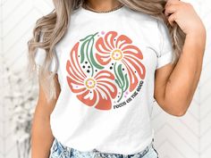 Elevate your casual style with our whimsical Boho Inspired T-Shirt, where a blend of artistic expression and premium comfort meets in perfect harmony. Crafted from the finest quality cotton, this t-shirt embodies the free-spirited essence of bohemian fashion, allowing you to move through life with ease and grace. Key Features: 🌼 Artistic Bohemian Design: Discover a t-shirt that reflects the intricate beauty of boho aesthetics, with a design that captures the spirit of wanderlust and creative expression. 👕 Luxurious Cotton: Immerse yourself in the softness of high-quality cotton, creating a sensation of comfort that accompanies you throughout your day. The fabric is not just cozy; it's a statement of premium quality. 🌸 Effortless Style: Elevate your wardrobe with a t-shirt that effortles Bohemian White T-shirt With Graphic Print, White Bohemian T-shirt With Graphic Print, White Bohemian T-shirt With Letter Print, Bohemian White Shirt With Graphic Print, White Bohemian Shirt With Graphic Print, White Bohemian Shirt With Crew Neck, White Bohemian Crew Neck Shirt, White Bohemian Top With Graphic Print, Bohemian Artwork