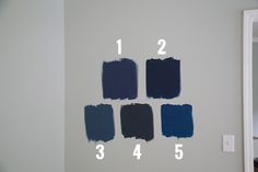 the wall is painted with different shades of blue and white paint, including dark blue