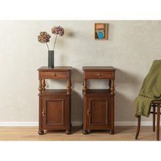 two wooden side tables sitting next to each other on top of a hard wood floor