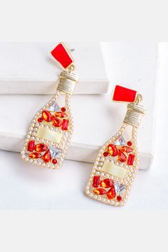 Red Champagne Bottle Rhinestone Earrings Length of the earrings is 6.5cm, width is 2cm. Sugar Boutique - ships from Shawnee, KS Family run boutique - ❤ Shipping and return info - https://www.sugarboutiquekc.com/pages/shipping-returns Red Champagne, Bottle Earrings, Wine And Liquor, Liquor Bottles, Girls Jewelry, Rhinestone Earrings, Modern Fashion, Modern Materials, Sacramento