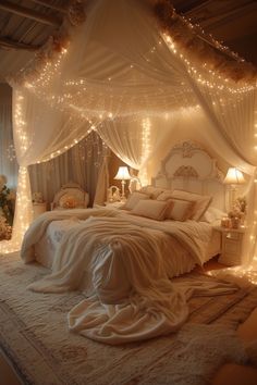 a white bed with lights on the headboard and canopy over it in a bedroom