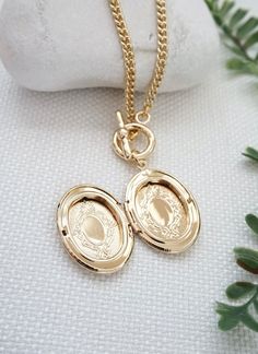 Gold locket necklace - oval locket pendant necklace, gold toggle necklace, curb chain necklace, locket charm necklace, photo holder necklace, gift for herDetails:----------- keep photos/messages of love ones close to your heart with this necklace- personalize this oval locket pendant by placing your own photo/message in the compartment- gold plated locket suspended on curb chain chain, finished with toggle claspDimension:--------------Locket: 32 mm x 21 mmChain length: 18 inchesPhoto opening : 2 Silver Medallion Necklace For Anniversary, Dainty Oval Pendant Locket Necklace For Anniversary, Dainty Oval Locket Necklace For Anniversary, Dainty Personalized Oval Locket Necklace, Dainty Oval Personalized Locket Necklace, Vintage Charm Oval Link Necklace As Gift, Oval Link Necklaces With Vintage Charm For Gifts, Dainty Oval Locket Necklace For Wedding, Heirloom Style Oval Pendant Locket Necklace With Vintage Charm