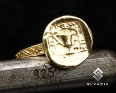 Ancient Greek Coin Trophy 24K Gold Vermeil 925 Silver Signet Ring Handmade Unique Dainty Gift Ring Mythological Fancy Art Pinky Ring 💍Item Details💍 SKU CODE: GACRIT2011 ★ Material: 24K Gold Plated 925 Sterling Silver ★ Silver Weight: App. 5.38 Grams {6 USA Size] ★ Ring Diameter: 2,3-2,7 mm ★ Ring Size: Available in variations  ★ Coin: Trophy  ★ Coin Size: 13,25 mm ★ Coin Metarial: 24K Gold Plated 925 Sterling Silver ★ Ring Plate: Available in variations to Rose Gold & 24K Gold & Black Oxided ? Gold Engraved Wedding Ring Stamped 925, Gold Open Engraved Ring Stamped 925, Handmade Gold Engraved Ring Collectible, Handmade Gold Engraved Ring For Anniversary, Ceremonial Sterling Silver Engraved Gold Ring, Handmade Gold Signet Ring For Ceremonial Use, Handmade Symbolic Gold Engraved Ring, Gold Byzantine Signet Ring As Gift, Handmade Gold Byzantine Rings