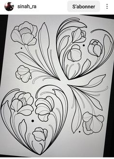 a drawing of some flowers on a piece of paper with black and white lines in the middle