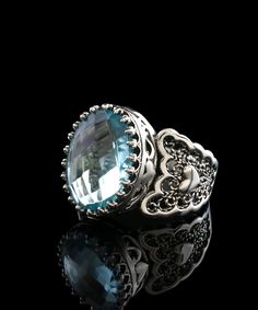 Filigranist's 925 sterling silver filigree art double heart detailed cocktail ring will help you ring in the new year in style! This gorgeous ring allows you to show your uniqueness and sense of style while creating a statement that will turn heads. This ring is precision-crafted from high-quality 925 sterling silver and contains a gorgeous Sky Blue Topaz gemstone embellishment as well as the brand logo. This ring's gorgeous style makes it a great choice for any event, and it's sure to get you c Ornate Silver Topaz Ring For Gift, Filigree Topaz Ring Gift, Filigree Blue Topaz Ring For Gift, Fine Jewelry Blue Topaz Filigree Ring As Gift, Ornate Filigree Topaz Ring As A Gift, Ornate Filigree Topaz Ring Gift, Sterling Silver Topaz Ring With Intricate Design For Gift, Gorgeous Style, Velvet Purse