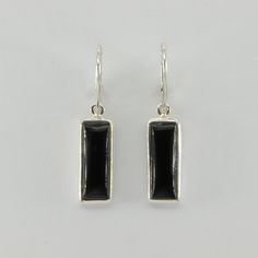 These is a beautiful pair of Black Onyx Earrings. The earrings are made out of solid 925 Silver and there is no nickel or other substances causing most allergies. This makes the earrings hypo allergenic. Size of one earring in total: 3.8 x 1.3 cm or 1.50 x 0.51 inch The hooks are about 3/4 inch - or 1.8 cm - in length. You will receive the item in a gift box - perfect to surprise someone or yourself. Usually we ship on the same day we receive the payment for the order. We want you to be happy wi Elegant Rectangular Sterling Silver Earrings, Classic Earrings With Rectangular Stone For Gift, Classic Rectangular Stone Earrings As Gift, Classic Rectangular Stone Earrings For Gift, Minimalist Oblong Earrings For Formal Occasions, Formal Minimalist Oblong Earrings, Minimalist Sterling Silver Oblong Earrings, Classic Sterling Silver Rectangular Earrings, Nickel-free Rectangular Earrings For Formal Occasions